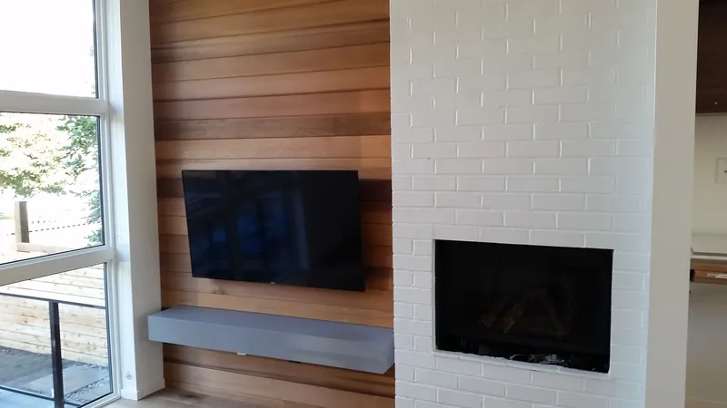 TV mounted on a timber feature wall