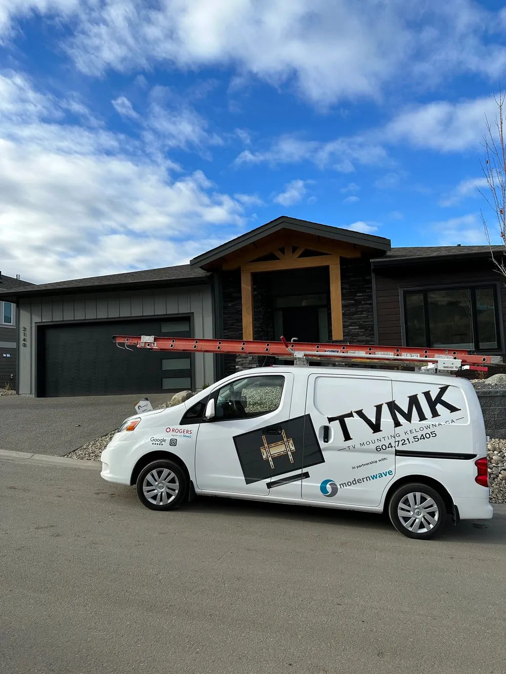 TV Mounting Kelowna van outside a home